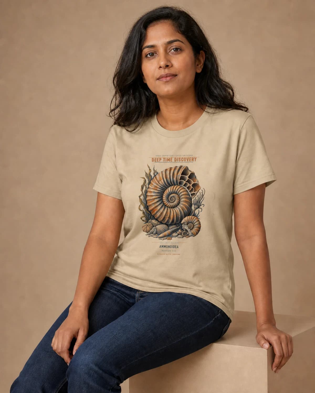 Adult wearing the Deep Time Discovery tee in Soft Cream