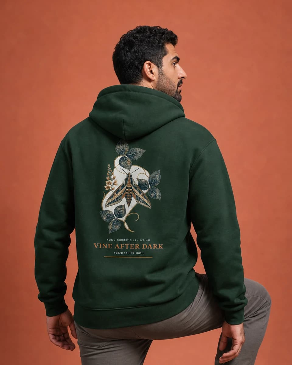 Adult wearing the Vine After Dark hoodie in Dark Green, back view